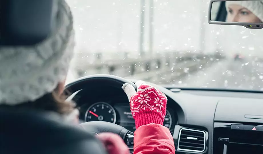 Women driving car in winters